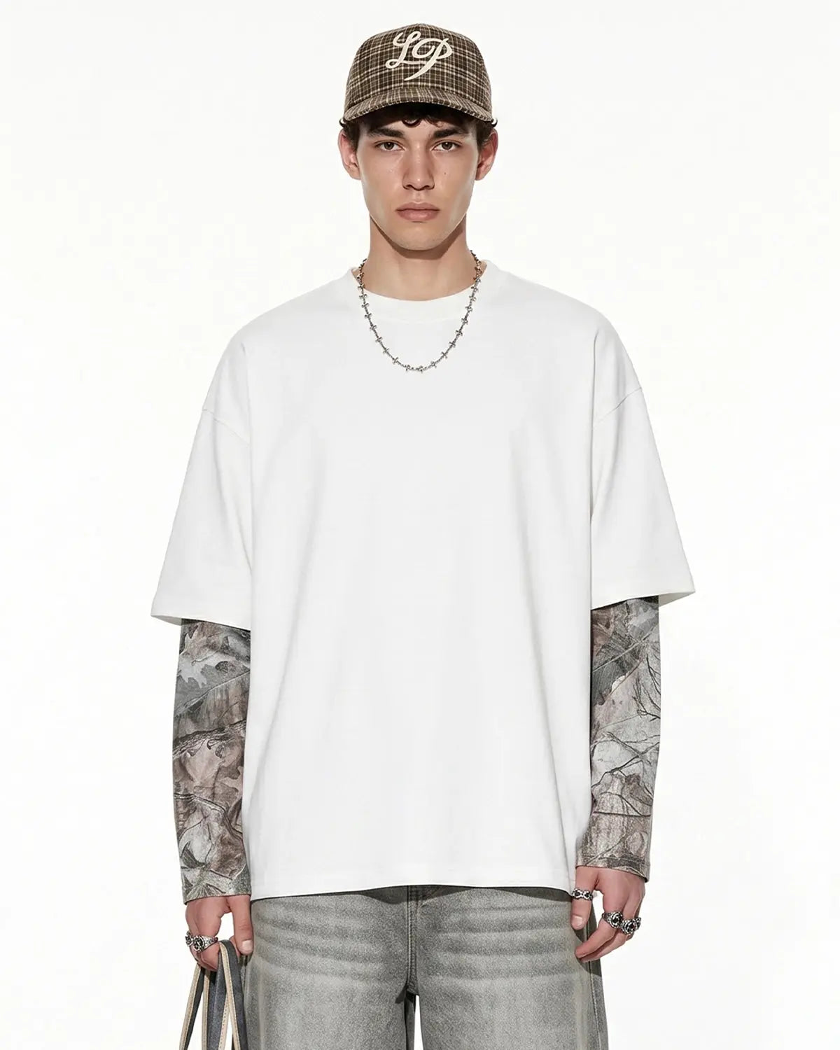 Inflation Streetwear camo layered oversized T-shirt with a relaxed fit, featuring a camouflage pattern and streetwear style.