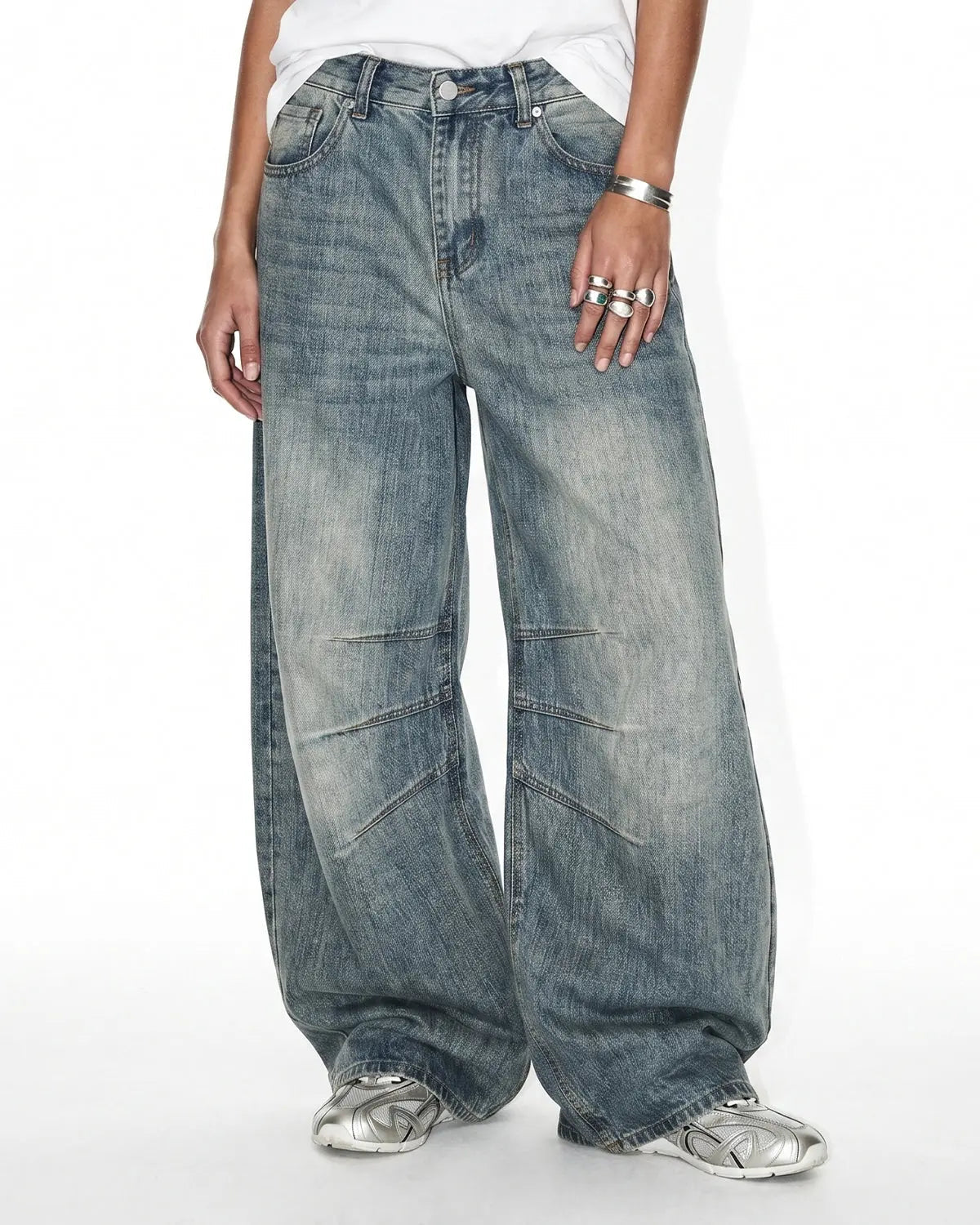 Deconstructed bamboo weave baggy jeans by INFLATION featuring loose fit, streetwear style, and unique woven fabric details.