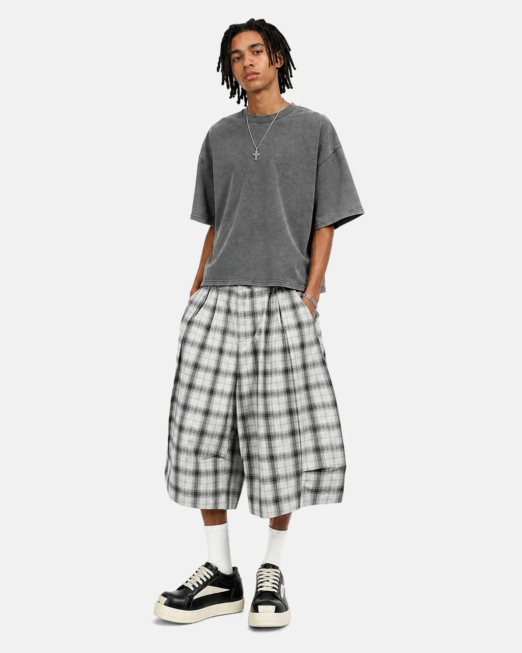 Inflation brand plaid longline casual shorts with a checkered pattern, featuring a relaxed fit and stylish design.