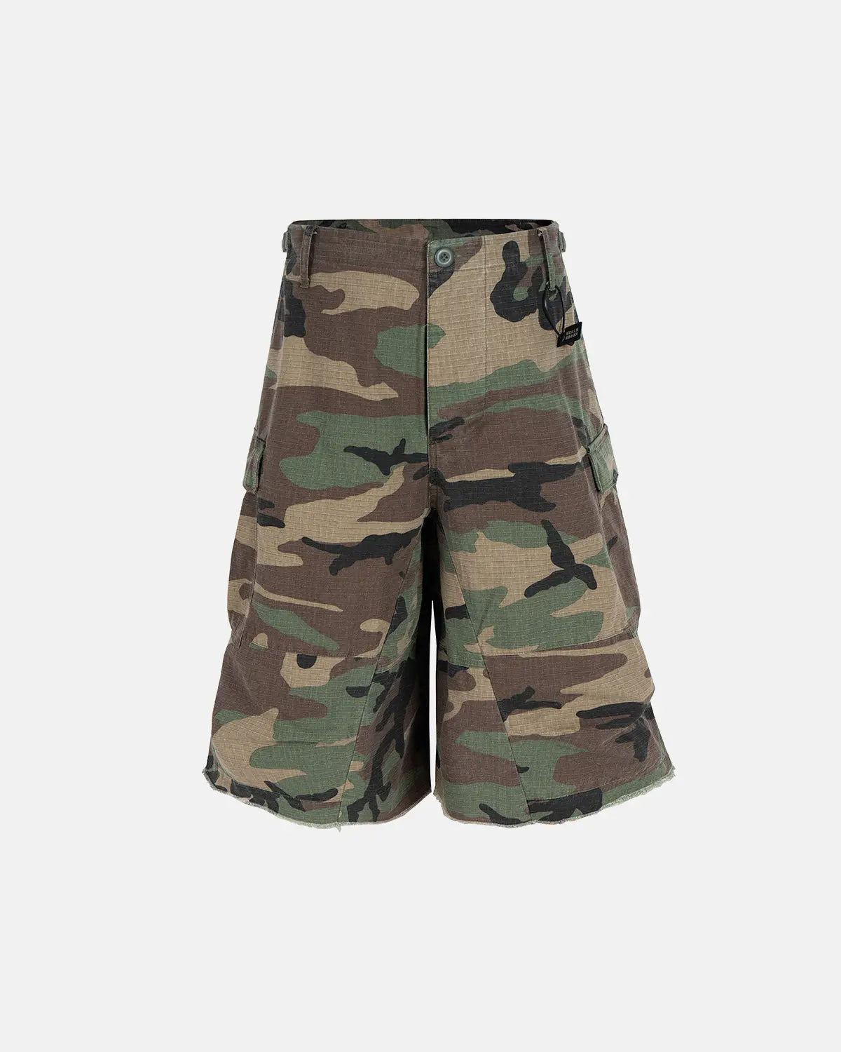 Inflation Streetwear oversized camo cargo longline shorts with multiple pockets and relaxed fit, featuring green and brown camouflage pattern.
