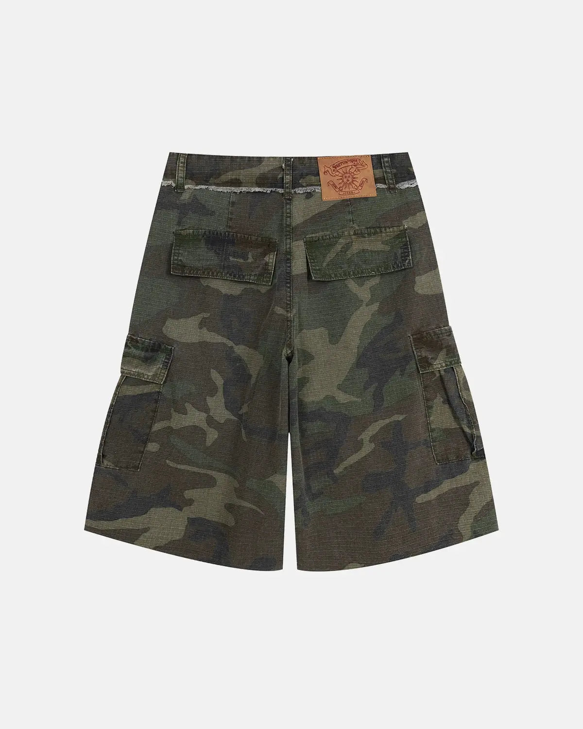 Camo utility longline shorts by INFLATION featuring a camouflage pattern, utility pockets, and a longline fit.