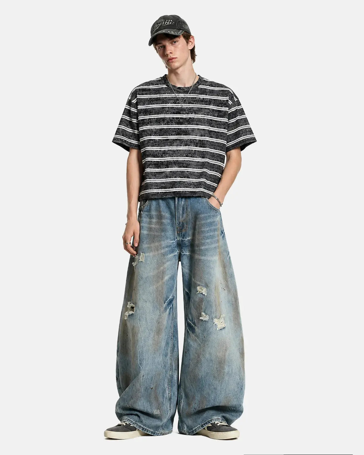 Distressed barrel jeans from Inflation Streetwear with a faded wash and ripped details, featuring a relaxed fit and distressed style.