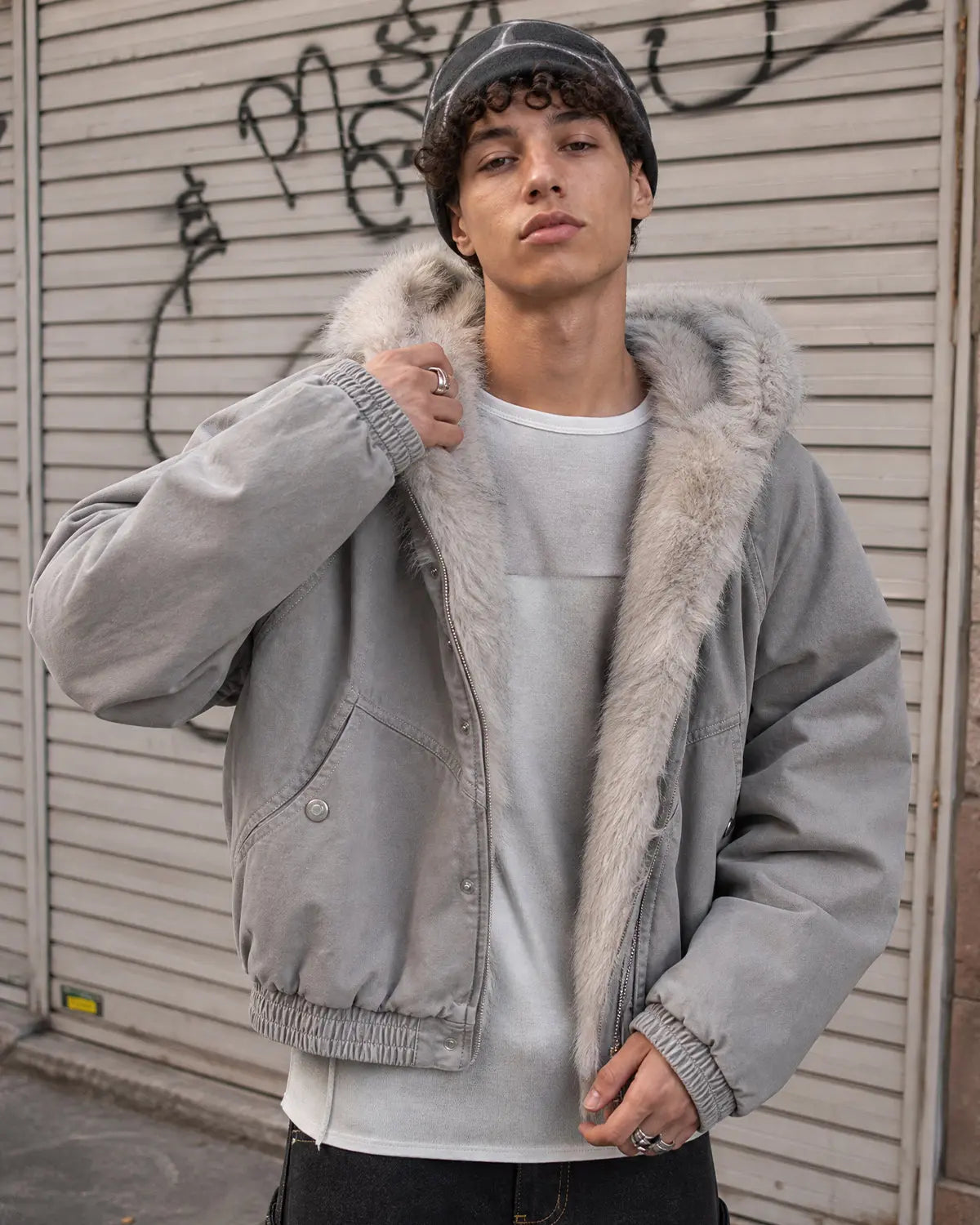 Inflation streetwear faux fur lined bomber hooded jacket, black with quilted design, front zipper, and adjustable hood.