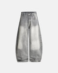 Blue acid wash barrel jeans by INFLATION Streetwear, featuring a relaxed fit and distressed denim style.