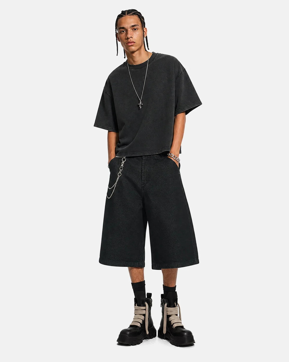 Black baggy long jorts from Inflation Streetwear featuring a relaxed fit, denim fabric, and casual style.