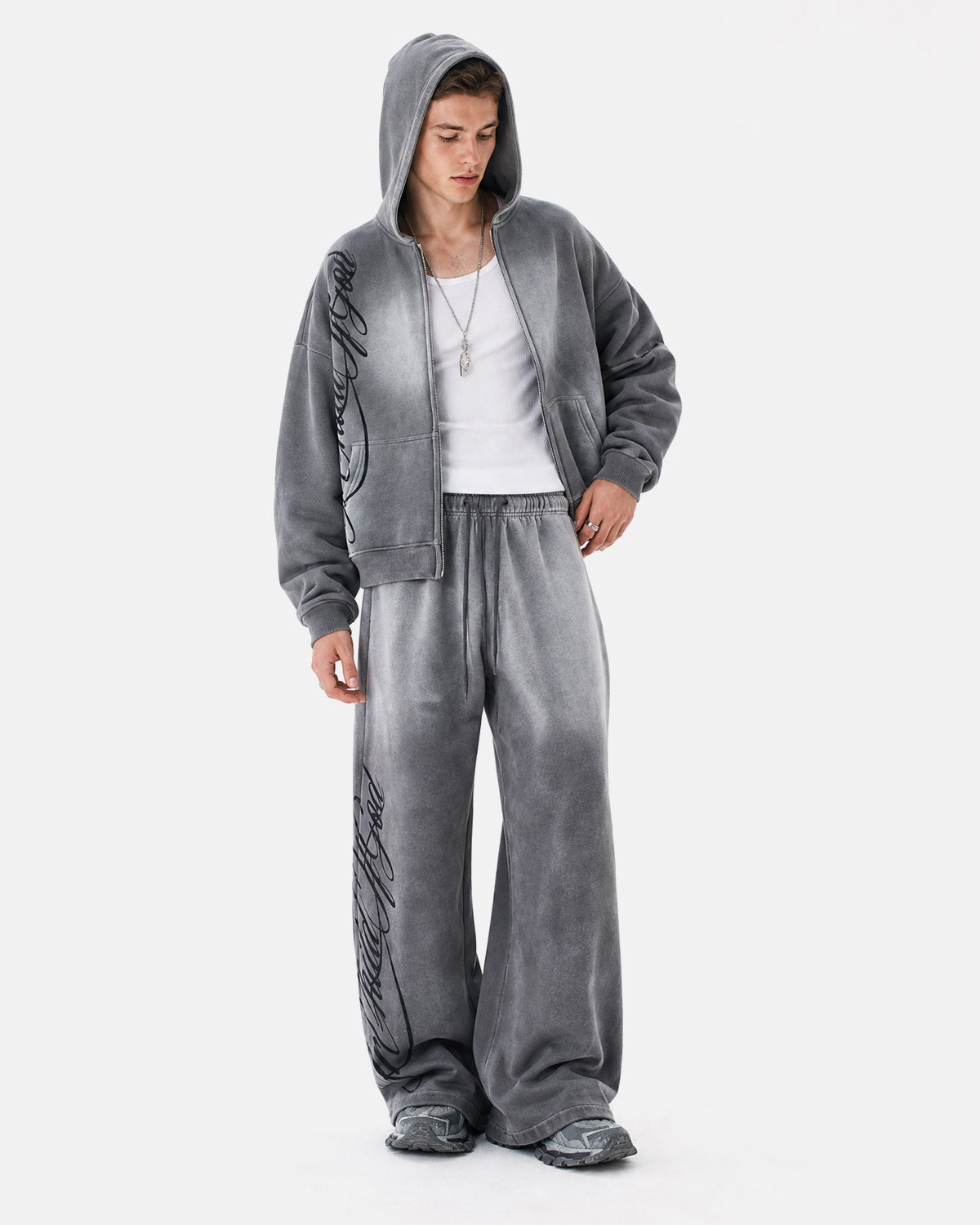 Acid wash zip-up hoodie by INFLATION with a drawstring hood and front pockets, laid flat on a white background.
