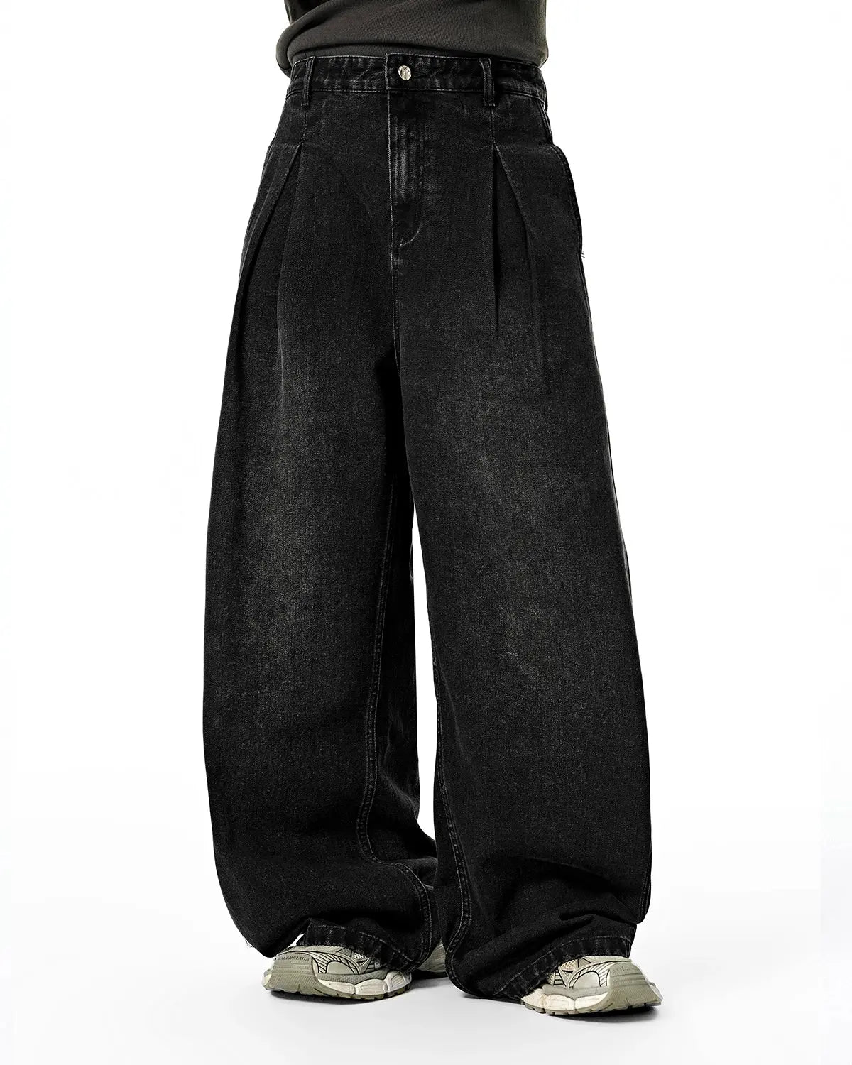 Acid washed super baggy jeans by INFLATION, streetwear pants with a relaxed fit and distressed, faded denim look.
