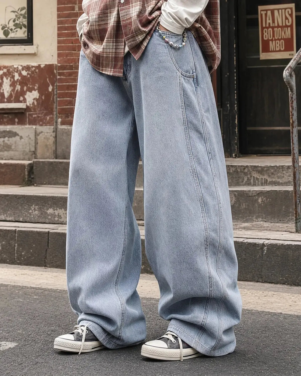 Acid washed distressed barrel jeans by INFLATION, stylish streetwear pants with a rugged, vintage look and faded finish.
