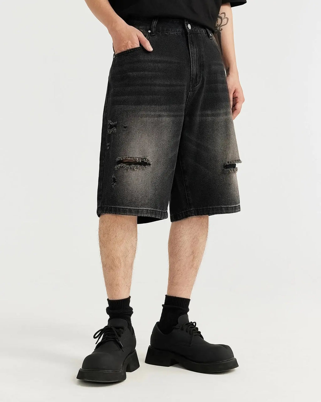 Vintage ripped washed jorts by INFLATION Streetwear, showing distressed denim shorts with frayed edges and a casual fit.
