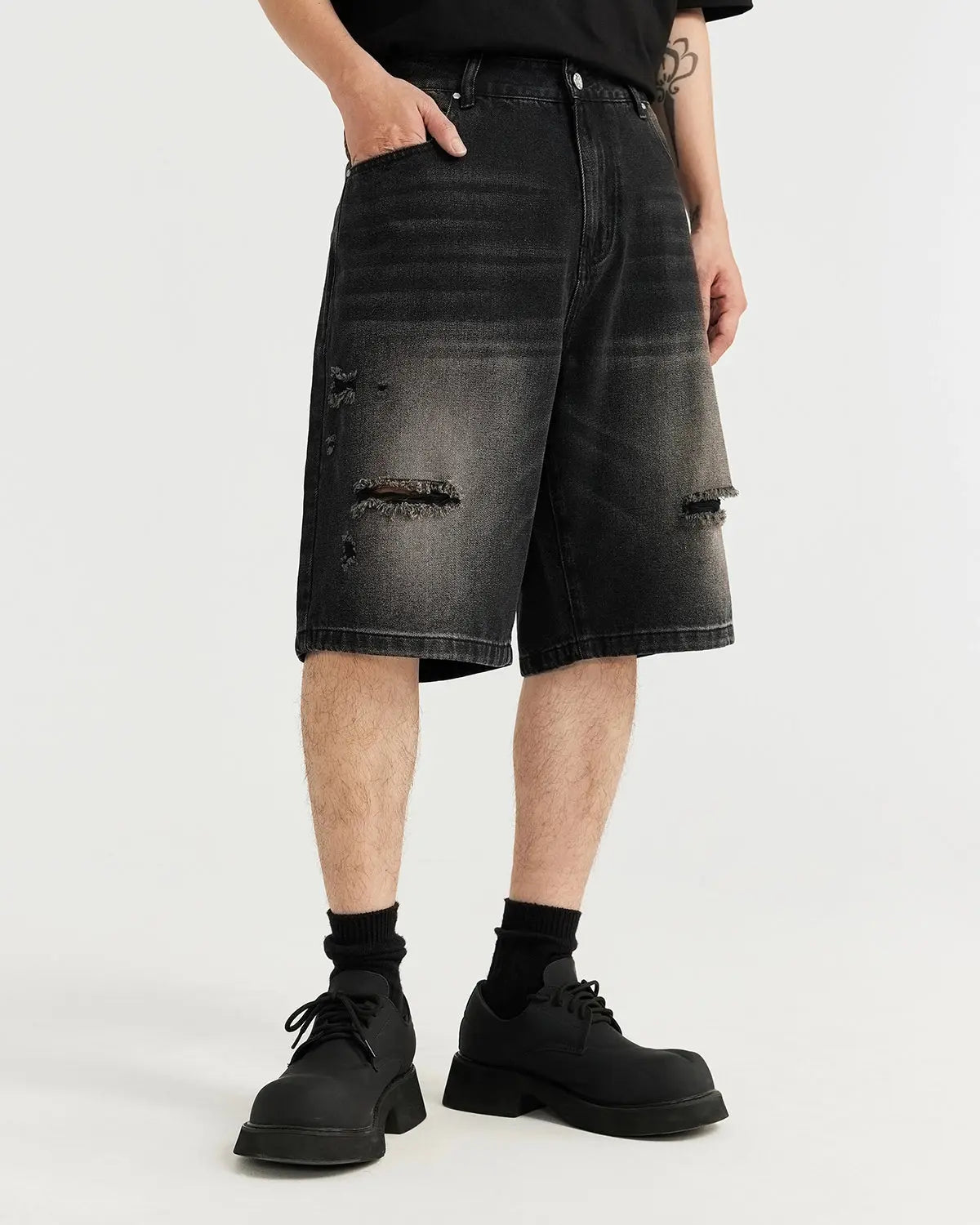 Vintage ripped washed jorts by INFLATION Streetwear, showing distressed denim shorts with frayed edges and a casual fit.