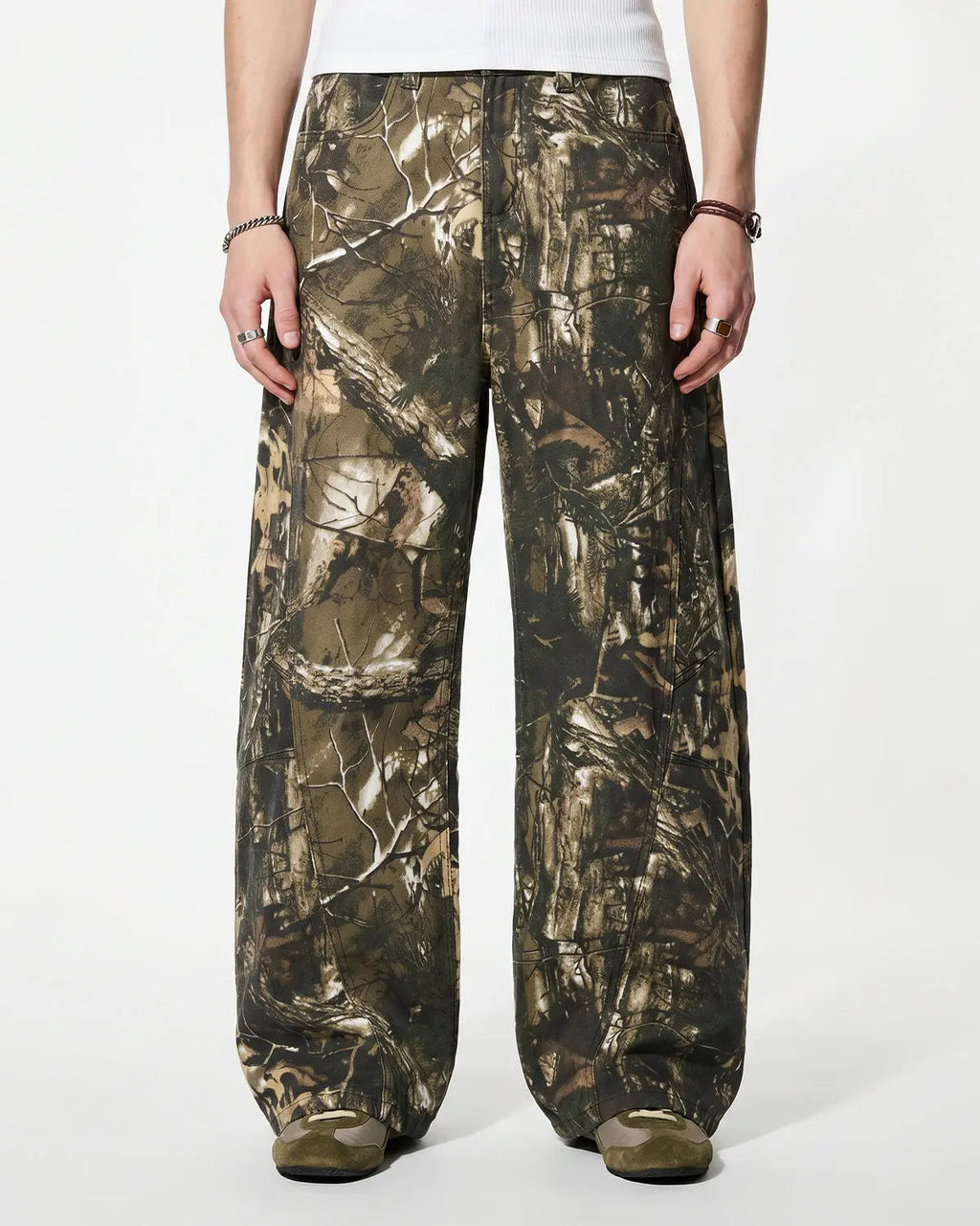 Pink embroidered camo baggy pants by INFLATION Streetwear with relaxed fit and detailed embroidery on the fabric.