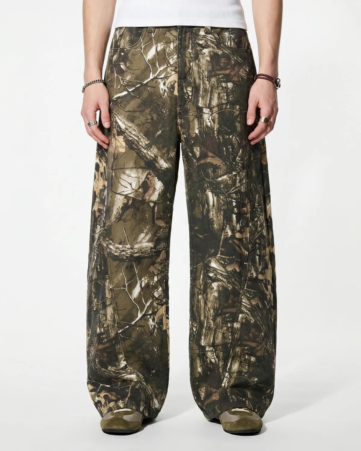 Pink embroidered camo baggy pants by INFLATION Streetwear with relaxed fit and detailed embroidery on the fabric.