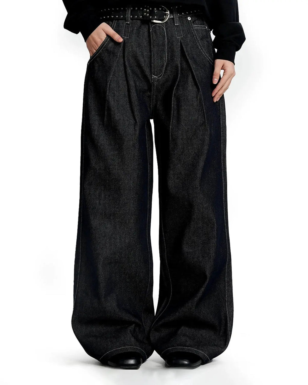 Raw baggy jeans with contrast stitching by INFLATION Streetwear, showcasing relaxed fit and detailed stitching on denim fabric.