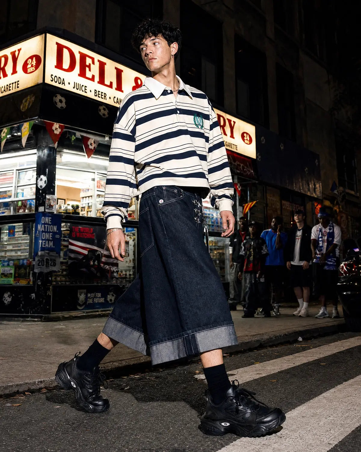 Inflation Streetwear buckle detail raw denim jorts, casual pants with distressed look and metal buckle accents on each leg.