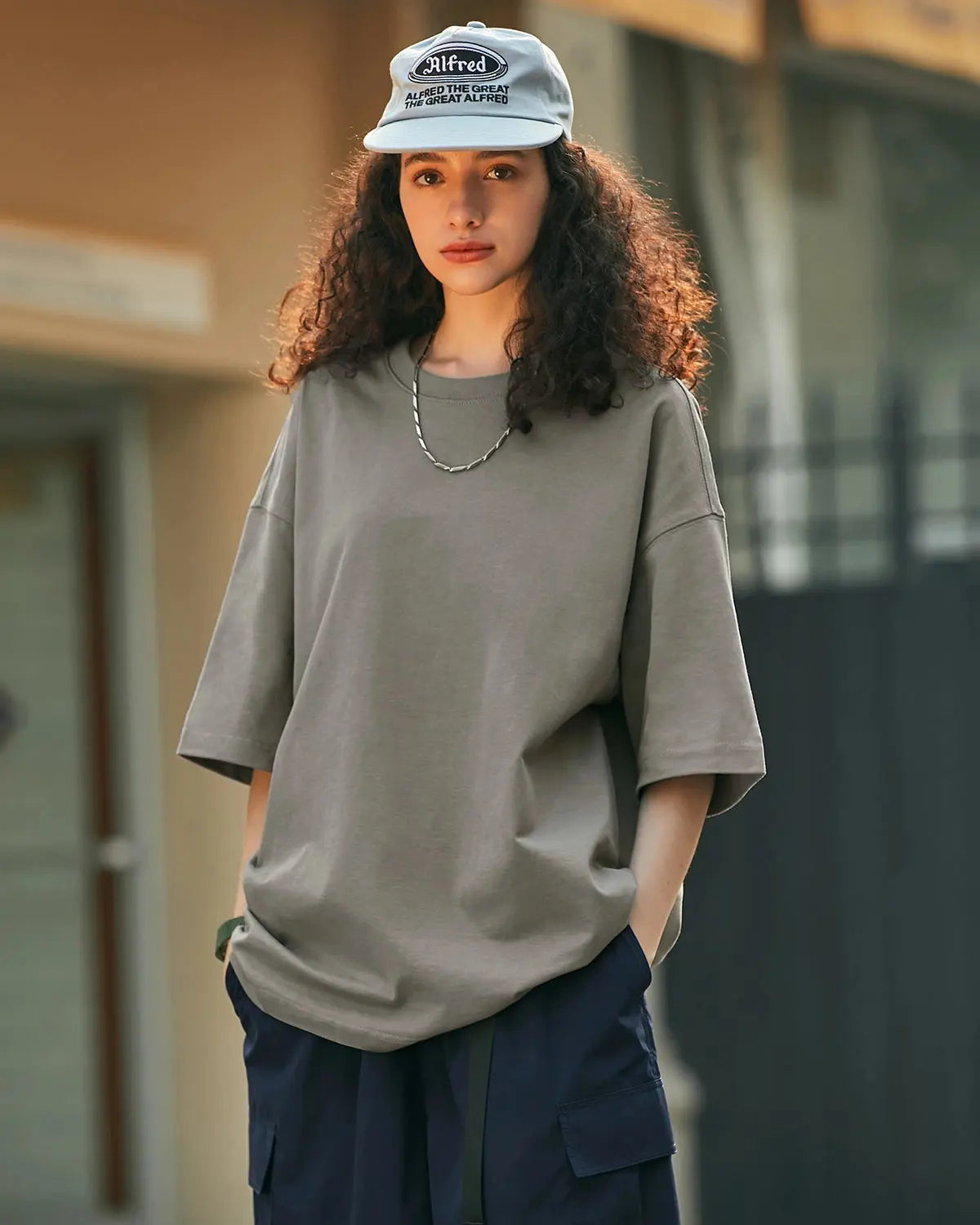 Inflation heavyweight cotton oversized T-shirt in neutral color, relaxed fit streetwear style with bold branding on front.