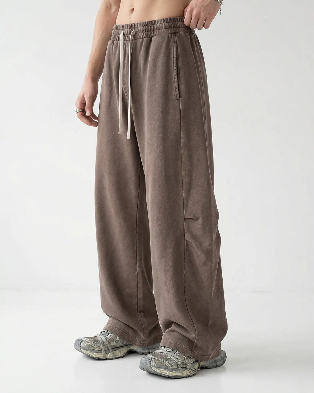 Distressed acid washed barrel sweatpant by INFLATION Streetwear, showing the relaxed fit and unique textured fabric.