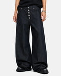 Inflation Streetwear Buttons Up Raw Baggy Jeans with distressed details and relaxed fit, shown on a model.
