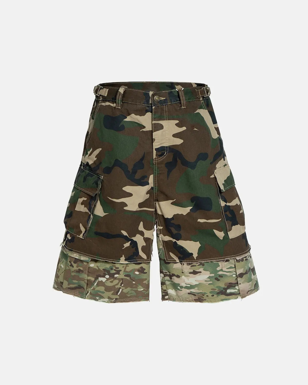Camo layered longline jorts by INFLATION, stylish streetwear denim shorts with camouflage print and extended length.