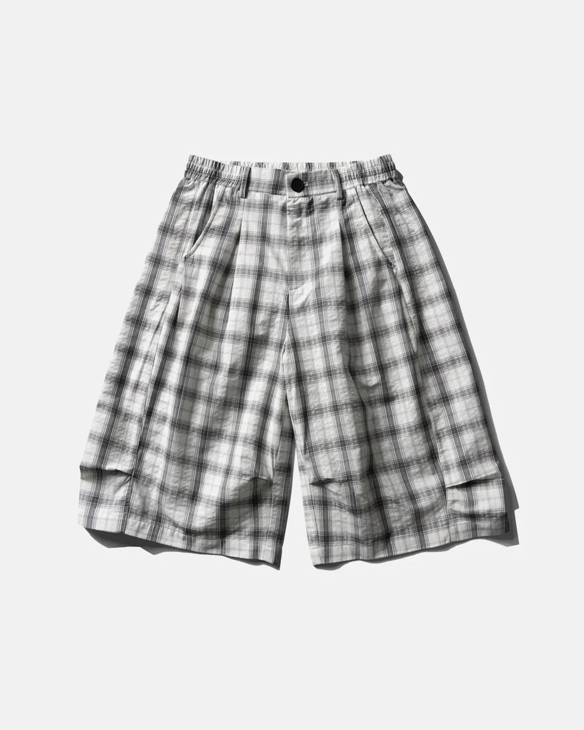 Inflation streetwear plaid longline casual shorts with a relaxed fit, featuring a checkered pattern and waistband detail.