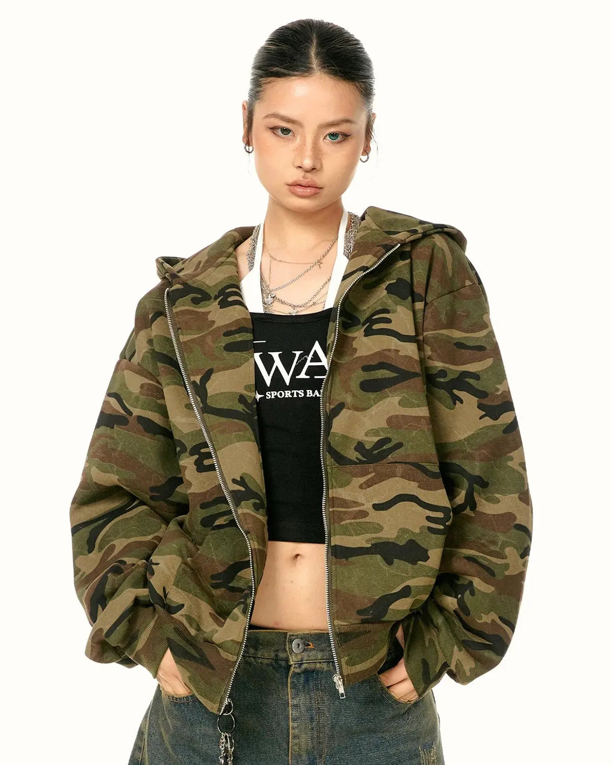 Inflation Streetwear camouflage zip-up jacket with hood, military-inspired design, and front pockets for a casual street style look.