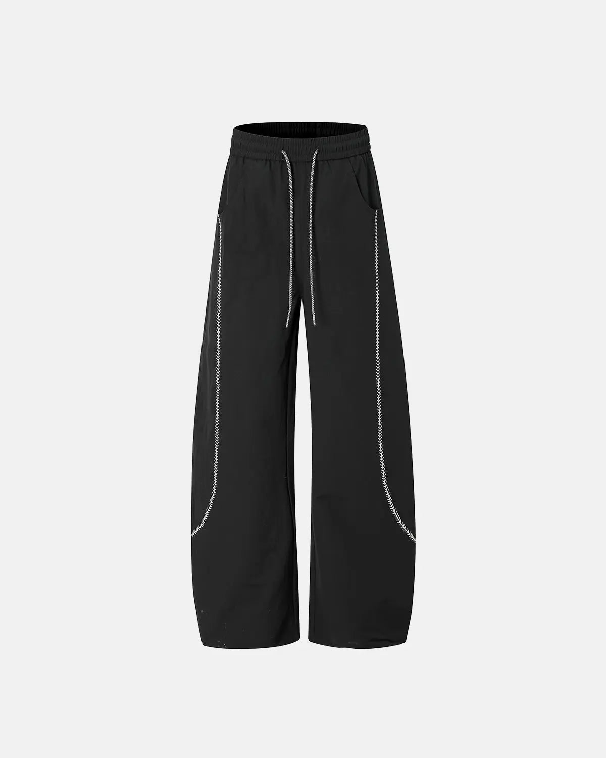INFLATION AirFlow Contrast Embroidered Track Pants showing black fabric with colorful embroidered details and tapered fit.