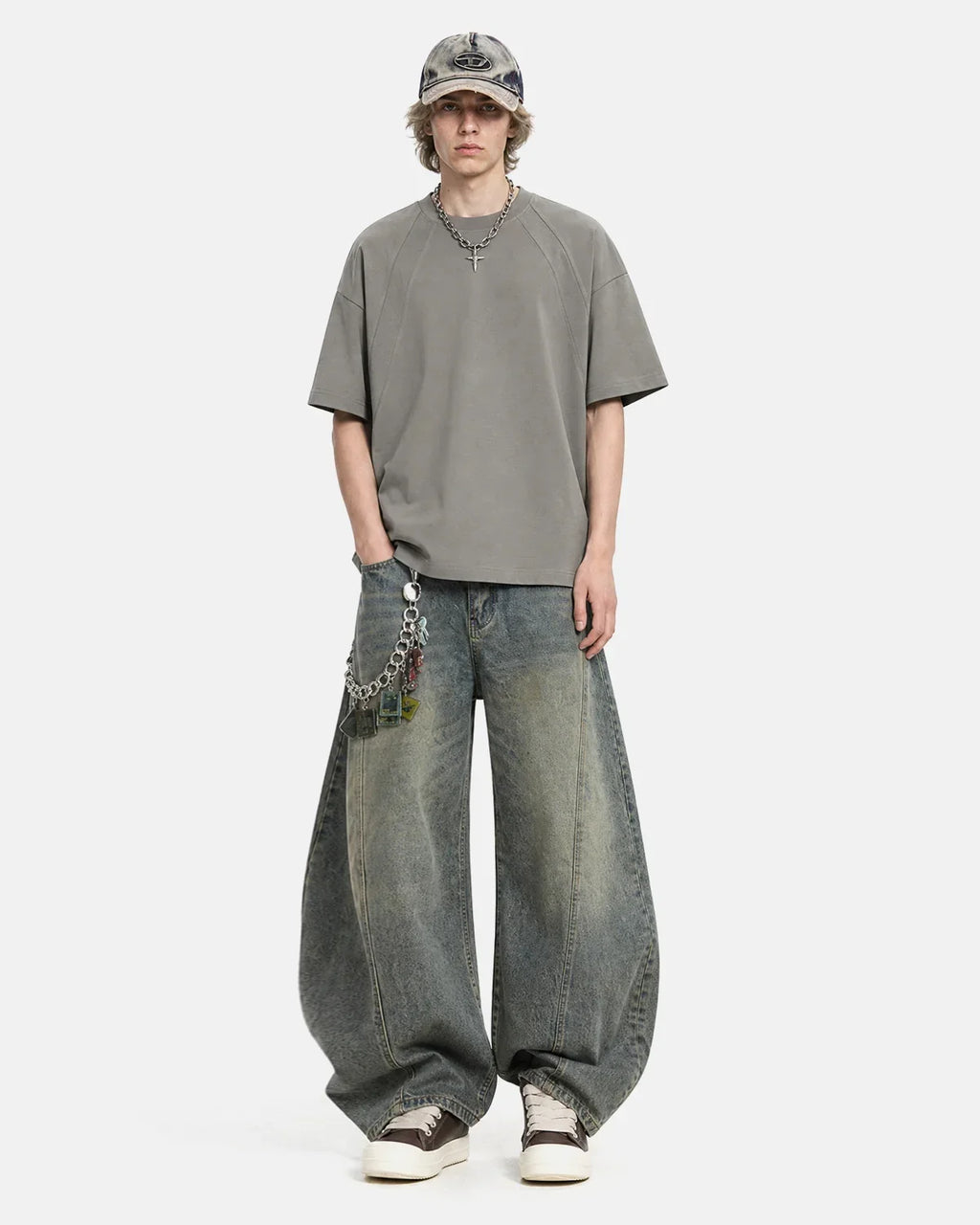 Boxy deconstructed T-shirt by INFLATION Streetwear featuring a relaxed fit and modern design, shown on a plain background.