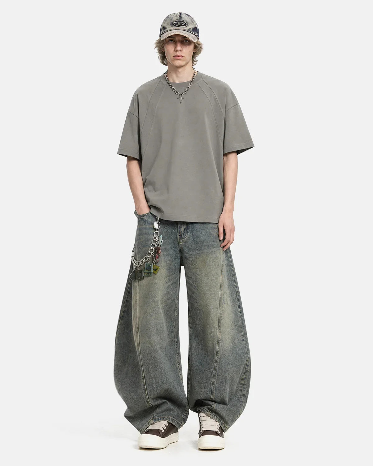 Boxy deconstructed T-shirt by INFLATION Streetwear featuring a relaxed fit and modern design, shown on a plain background.