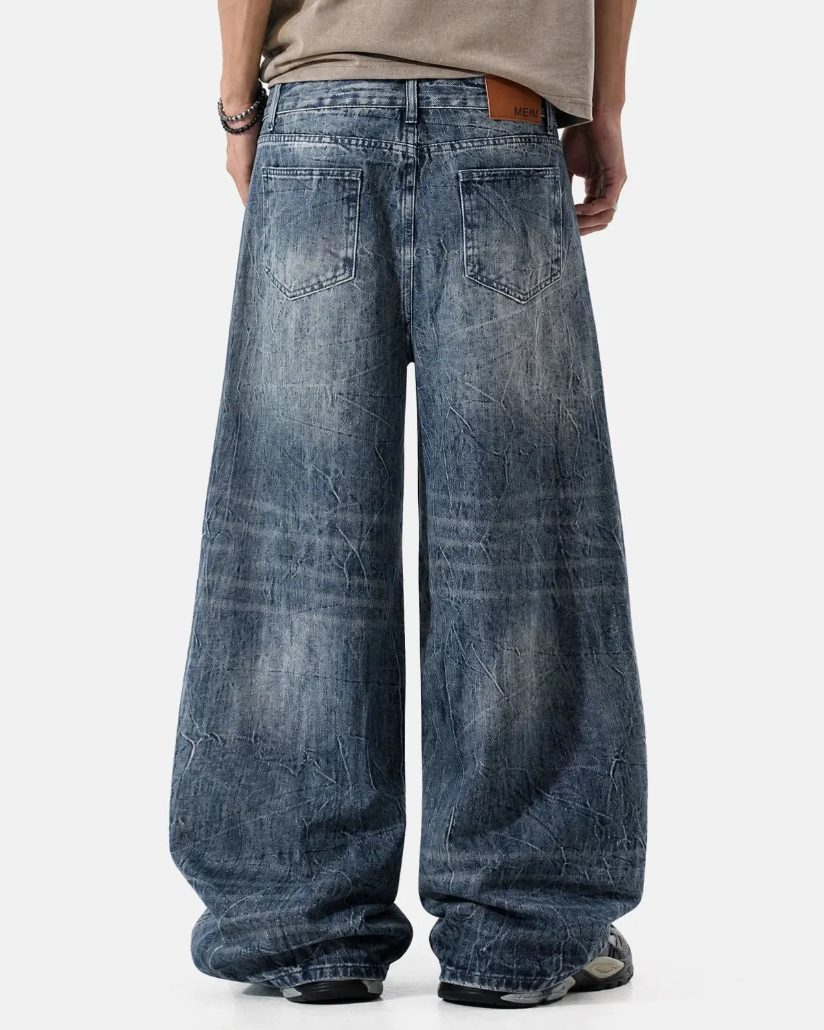 Inflation Textured Wash Baggy Jeans with relaxed fit and distressed details, showcasing trendy streetwear style.