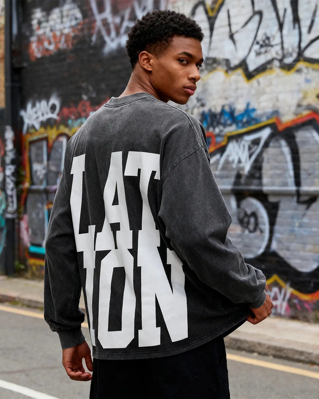 Inflation Streetwear reflective logo acid wash T-shirt featuring a distressed look and prominent logo on the front.