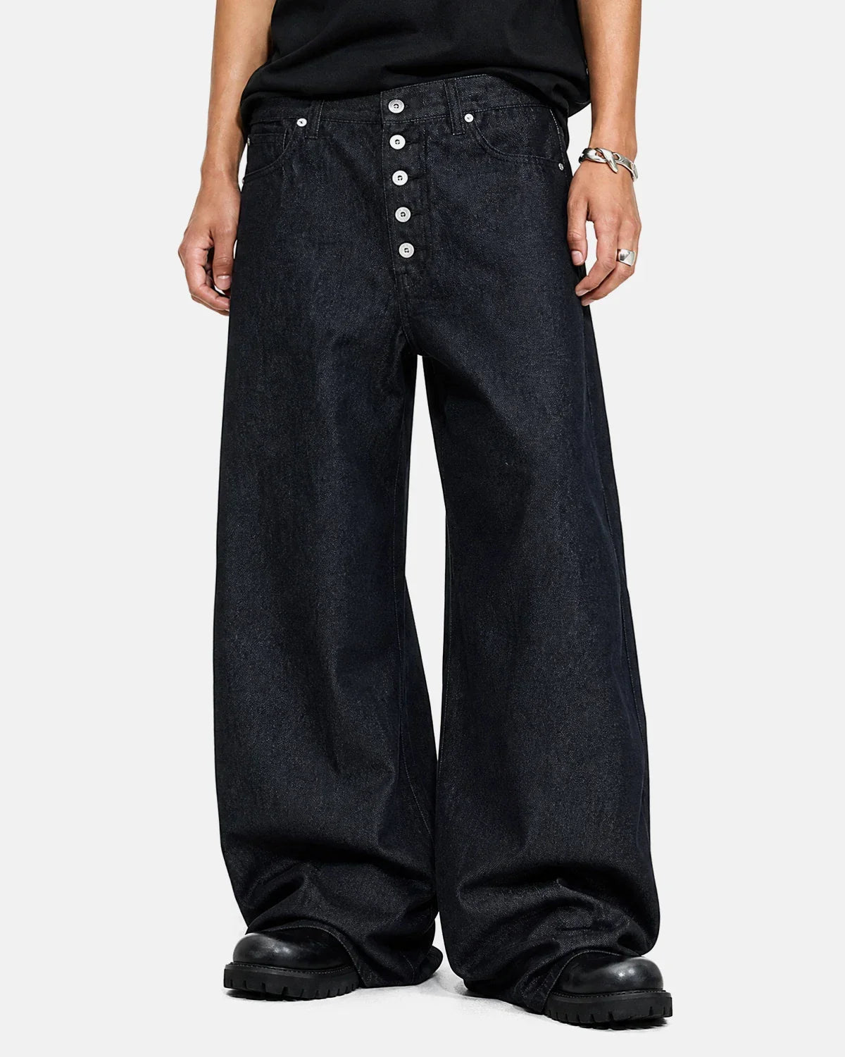 Inflation Streetwear Buttons Up Raw Baggy Jeans with button closure, featuring a relaxed fit and distressed denim style.