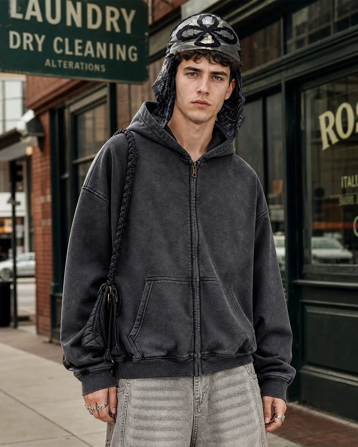 Vintage washed INFLATION zip-up hoodie with a relaxed fit and soft fabric, displayed on a hanger against a plain background.