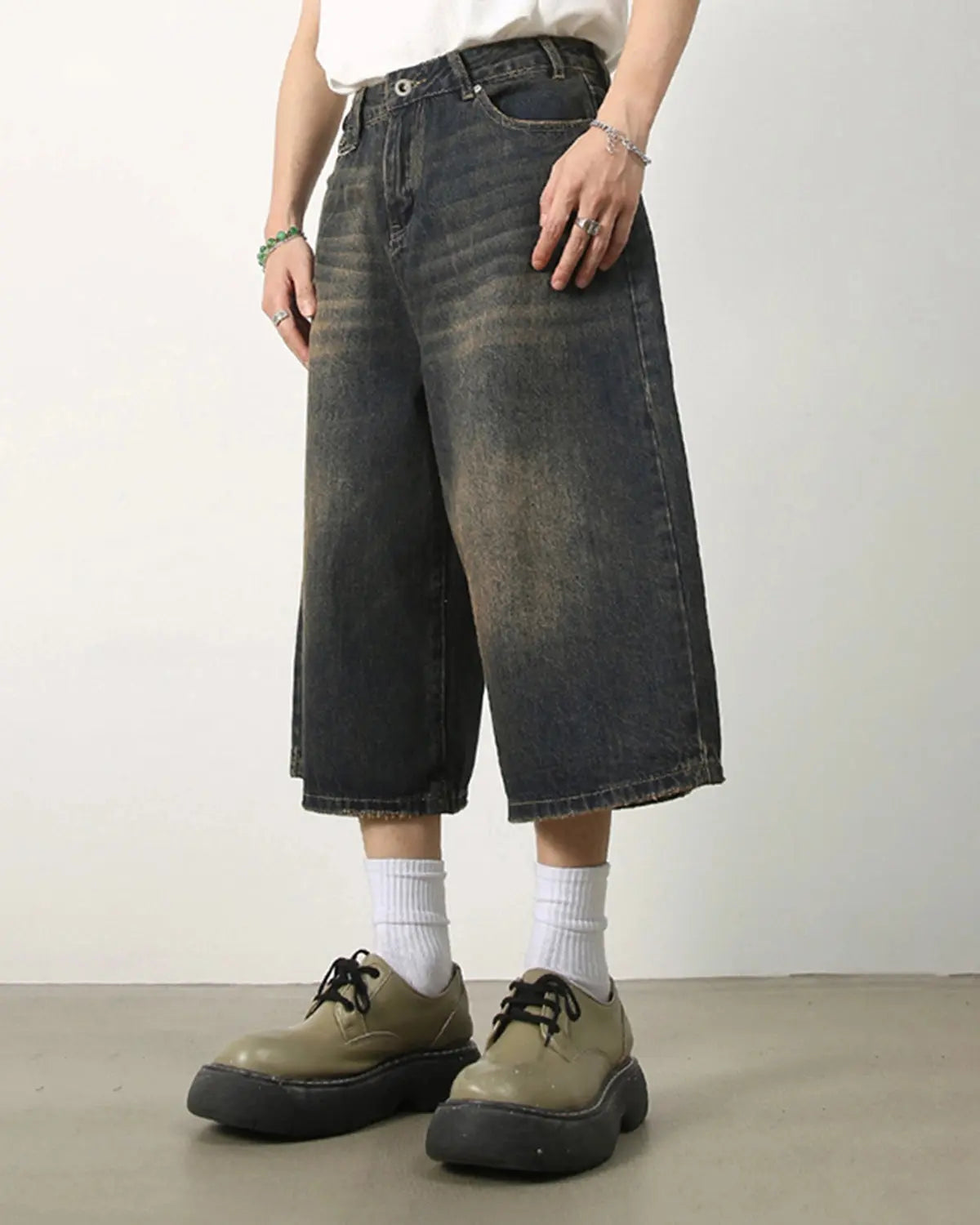 Baggy Jumbo Jorts by INFLATION featuring oversized denim shorts with a relaxed fit and distressed details.