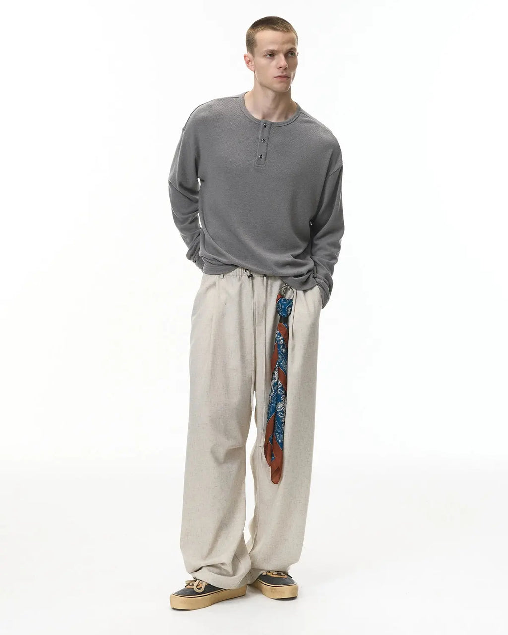 Inflation Streetwear Henley collar long sleeve t-shirt in neutral color, casual fit with buttoned neckline and ribbed cuffs.