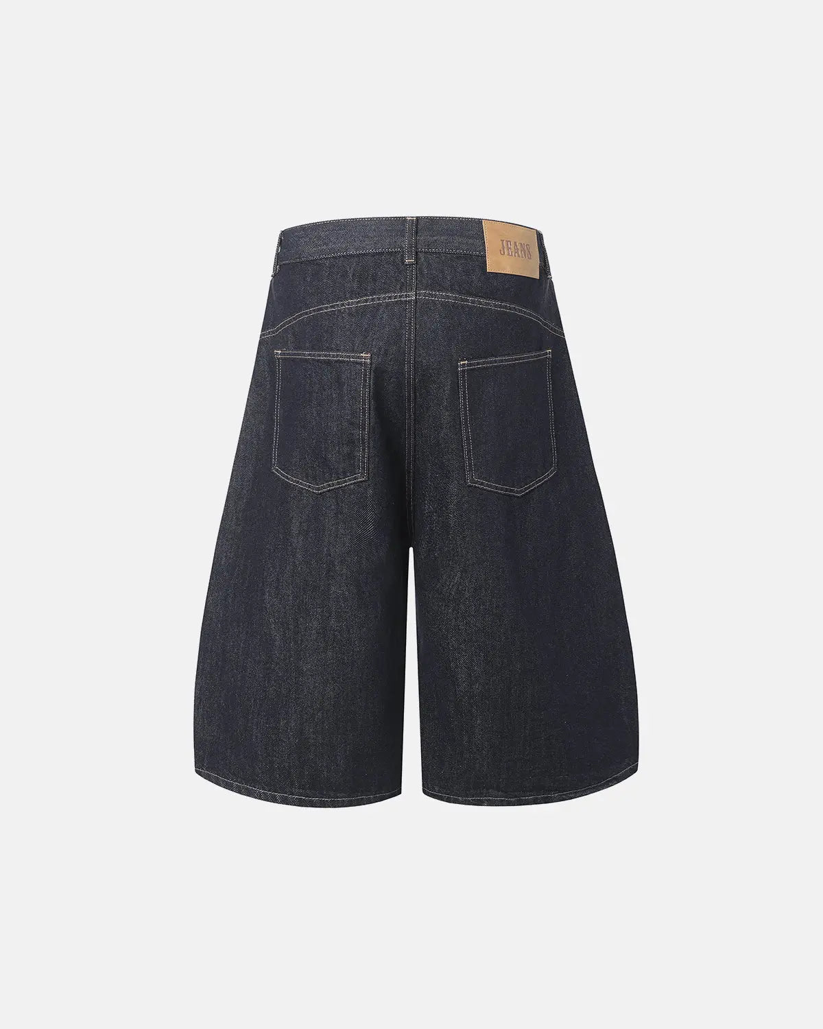Deconstructed scimitar denim longline jorts by INFLATION, featuring distressed details and a loose, streetwear-inspired fit.
