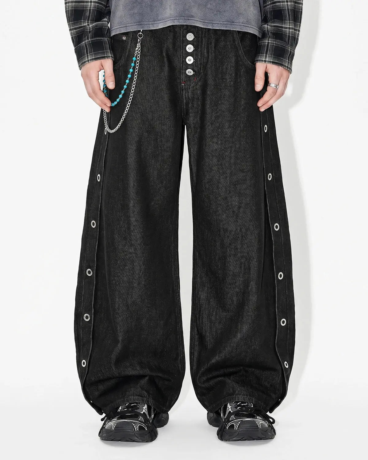 Inflation Streetwear barrel jeans with side eyelet buttons, showcasing a slim fit design and classic denim fabric.