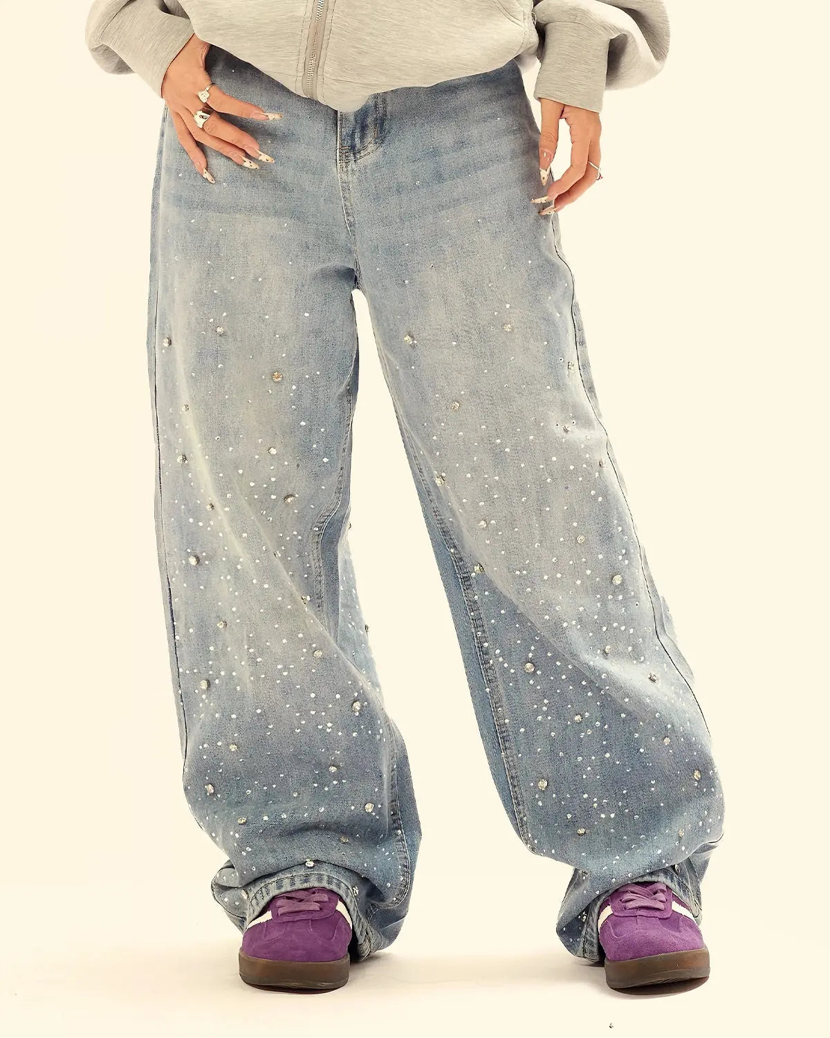 Inflation streetwear studded rhinestone baggy jeans with embellishments and relaxed fit, showcased on a model.