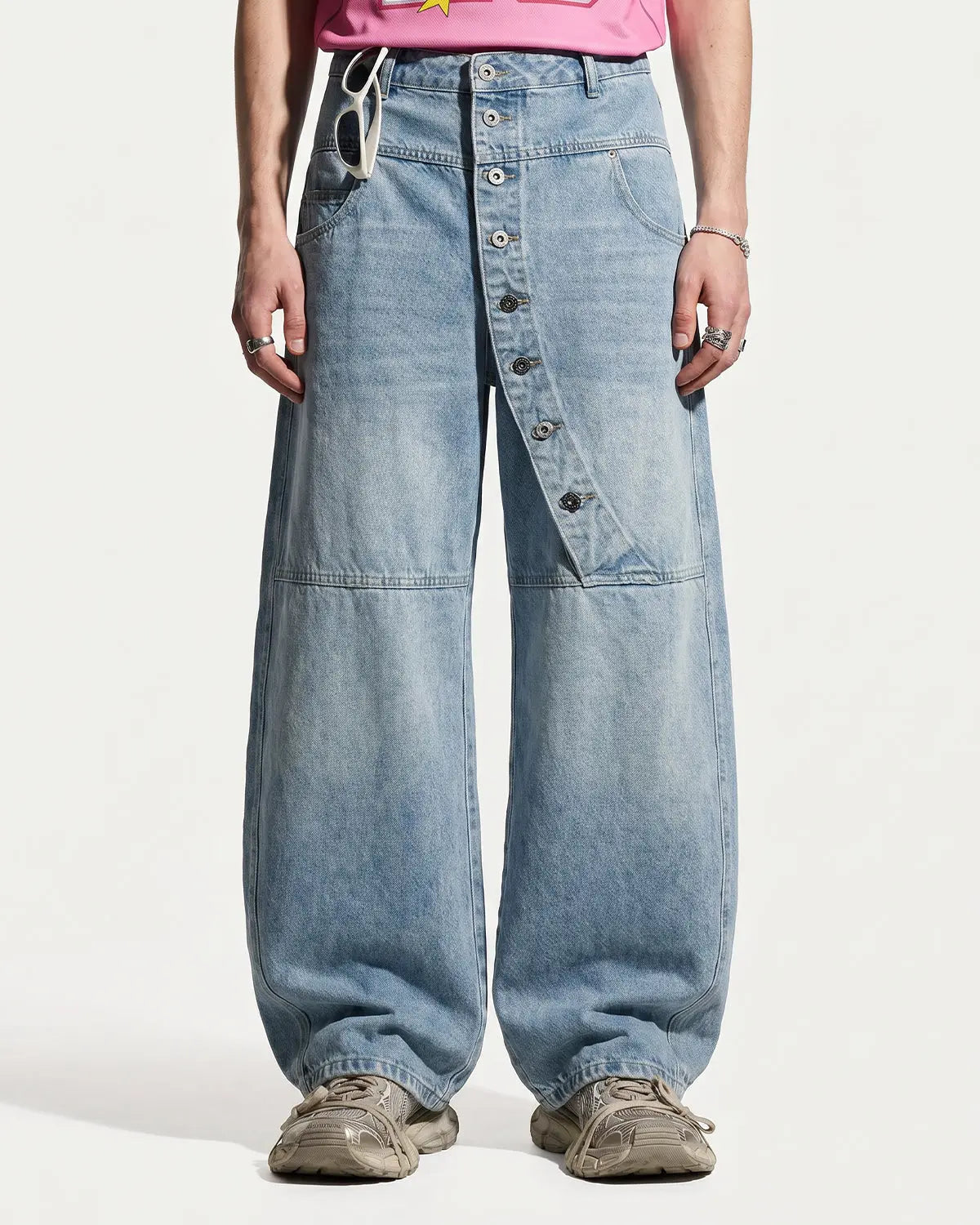 Inflation asymmetric button baggy jeans with oversized fit and stylish design, featuring prominent buttons and streetwear-inspired style.