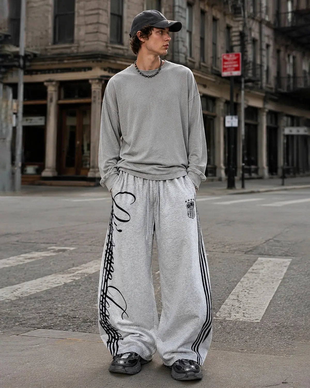 Inflation Script Stripe Baggy Sweatpants, relaxed fit streetwear sweatpant with bold stripe design and comfortable fabric.