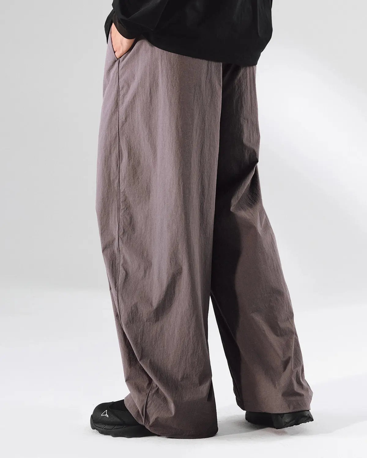Inflation outdoor quick dry track pants shown in black with sporty fit and elastic waistband, ideal for active outdoor wear.
