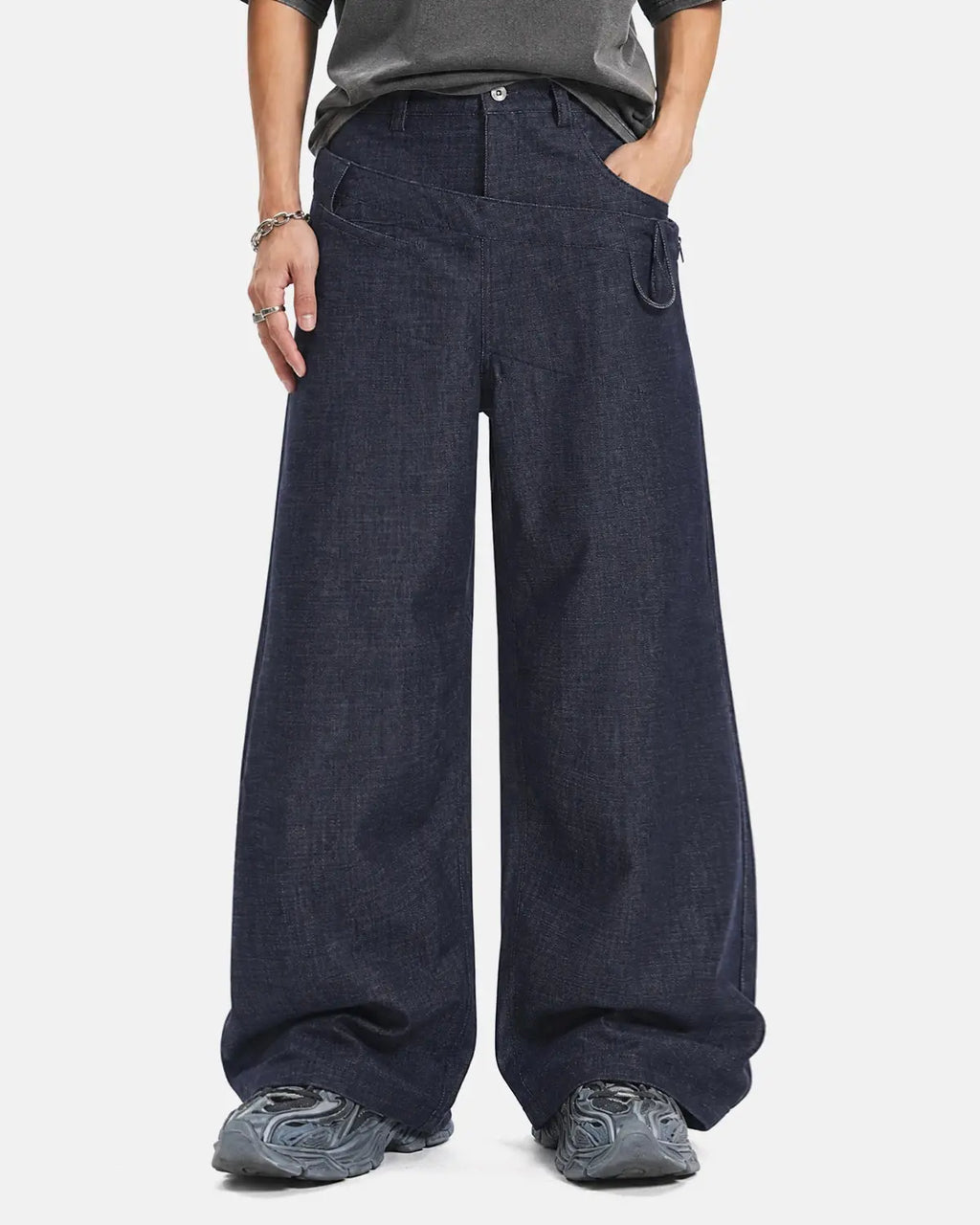 Inflation asymmetric wrap waist baggy jeans featuring a loose fit, distressed denim, and unique wrap detailing for streetwear style.