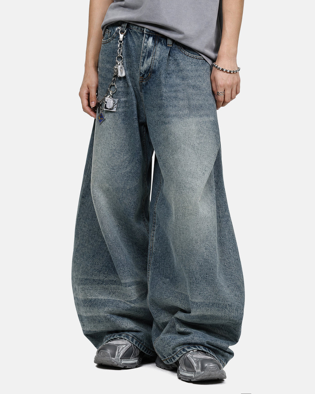 Inflation Whisker Acid Washed Barrel Jeans showing distressed denim with whisker fading and relaxed fit style.