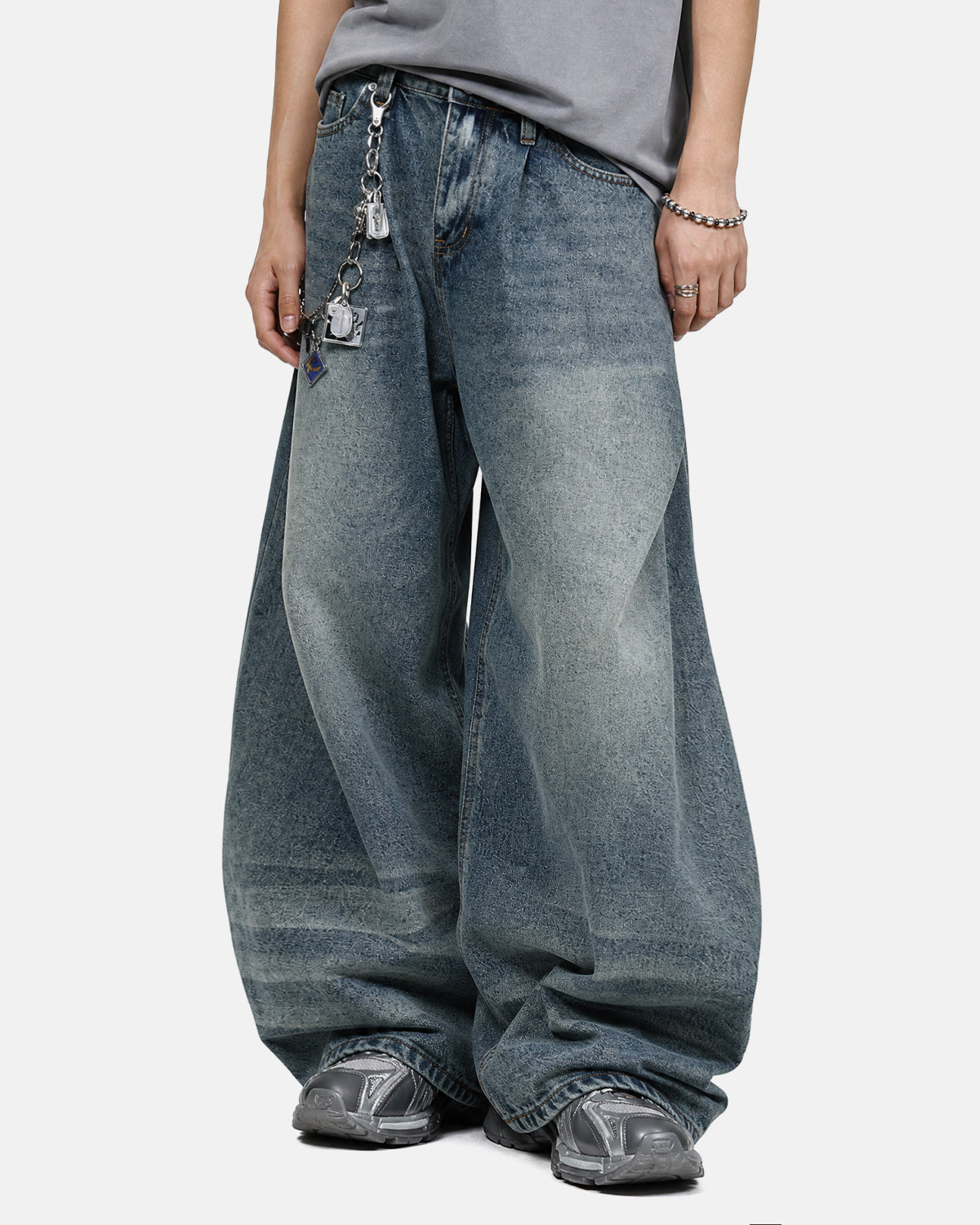 Inflation Whisker Acid Washed Barrel Jeans showing distressed denim with whisker fading and relaxed fit style.