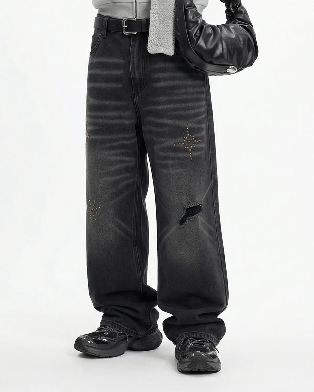 Distressed rhinestone ripped baggy jeans by INFLATION, featuring a loose fit, ripped details, and sparkling rhinestone accents.