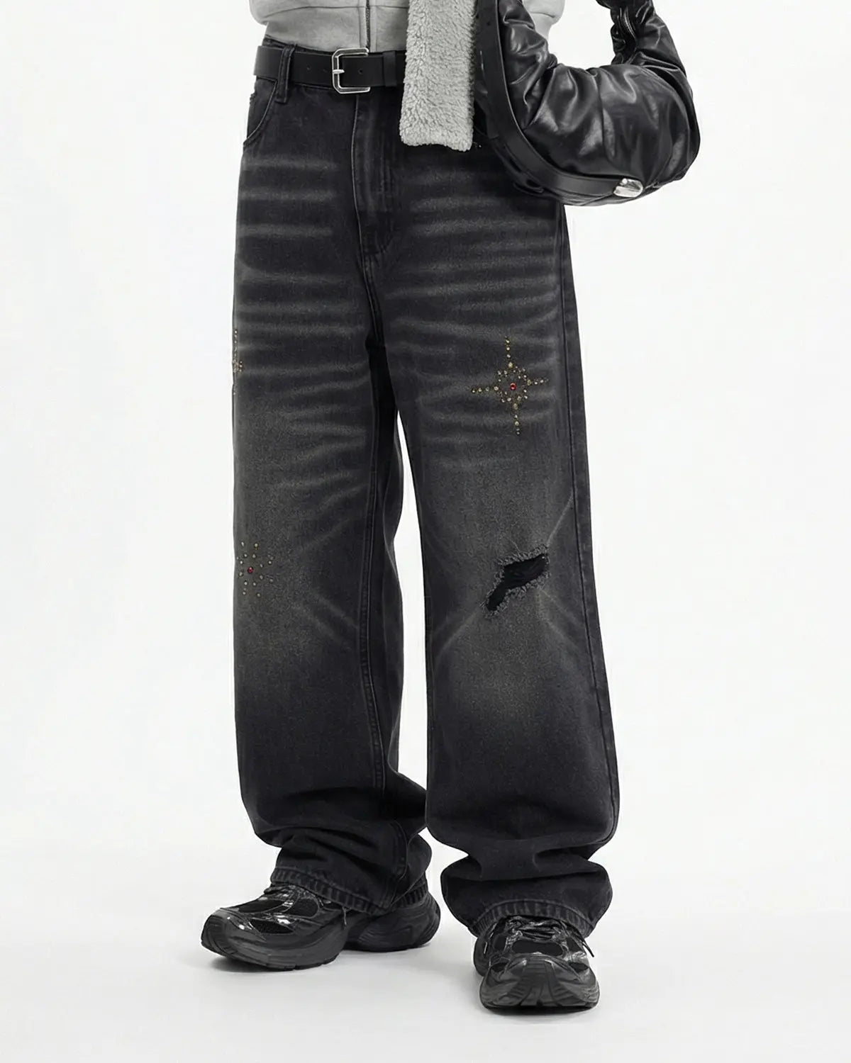Distressed rhinestone ripped baggy jeans by INFLATION, featuring a loose fit, ripped details, and sparkling rhinestone accents.