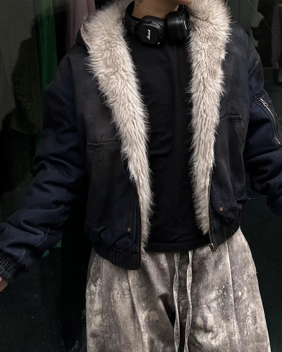 Inflation streetwear faux fur-lined acid wash bomber jacket with ribbed cuffs and collar, displayed on a hanger.