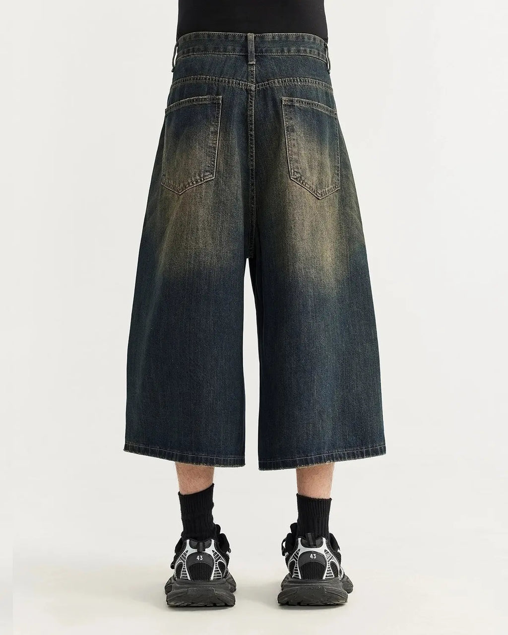 Acid washed longline baggy denim jorts by INFLATION, casual streetwear pants with a relaxed fit and distressed style.