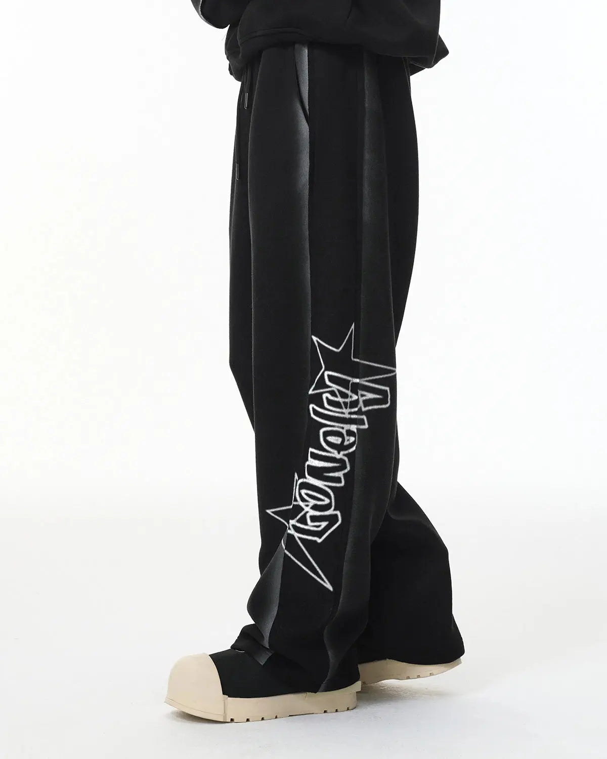 Inflation Stitching Spray-Painted Graffiti Sweatpant with bold spray paint graffiti design and stitching details on streetwear joggers