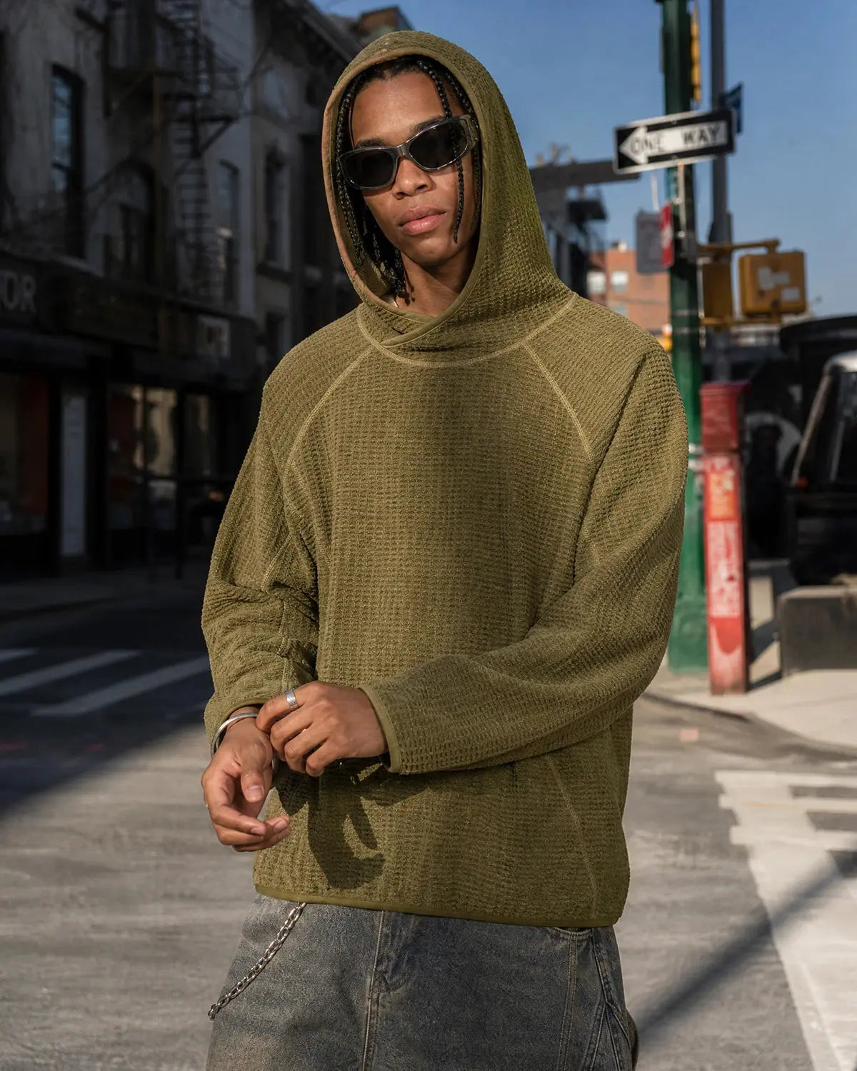 Inflation Thermolite lightweight grid texture hoodie in black with a relaxed fit and adjustable drawstrings, streetwear style.