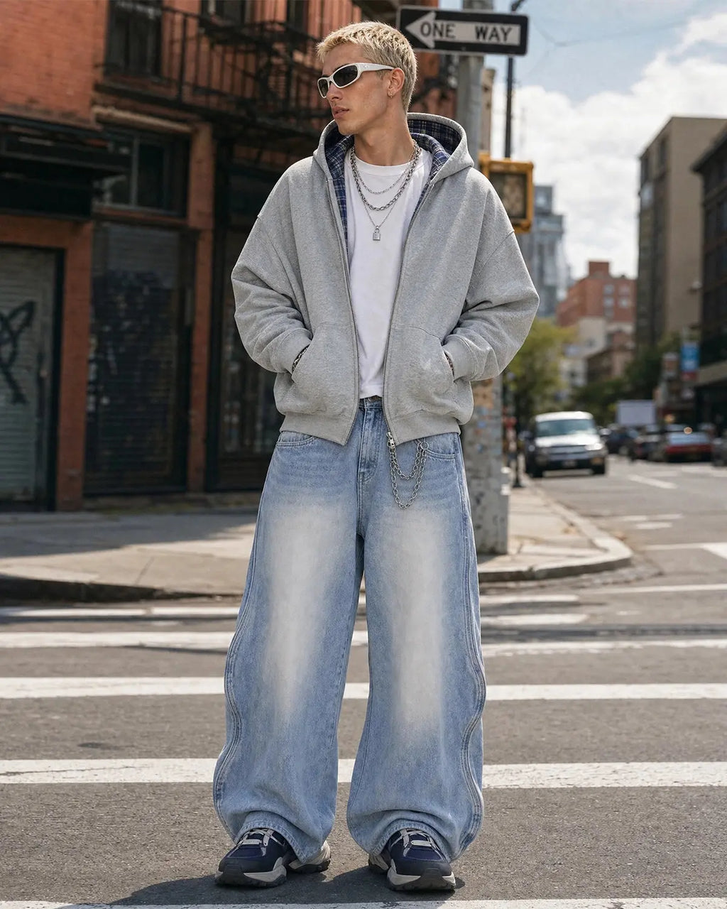 Inflation Wave Washed Baggy Jeans showing relaxed fit, light wash denim with wave pattern, casual style, and distressed details.