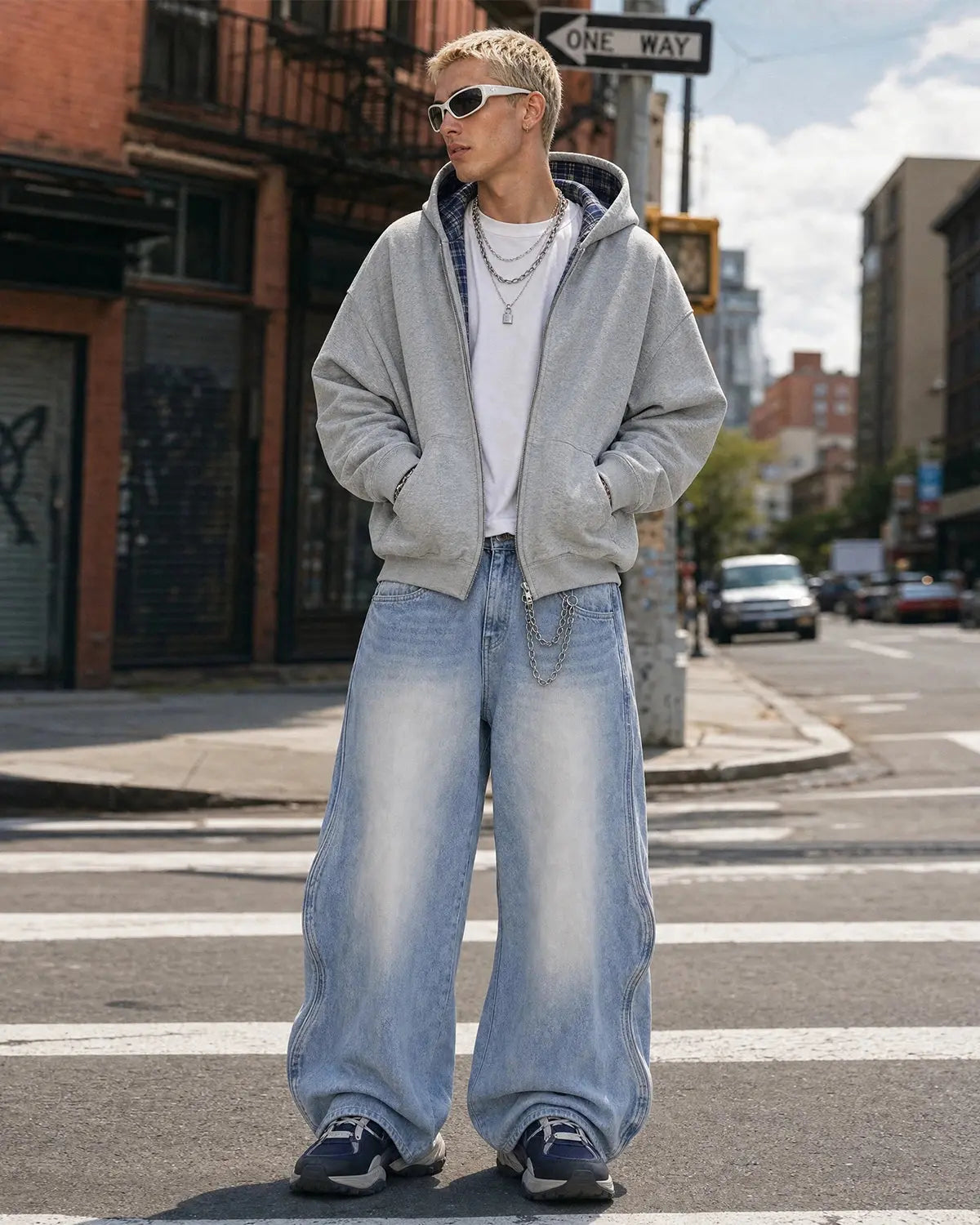 Inflation Wave Washed Baggy Jeans showing relaxed fit, light wash denim with wave pattern, casual style, and distressed details.